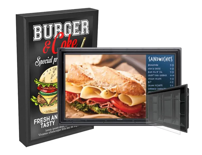 An outdoor drive-through menu board displays various sandwich and burger menu items. 