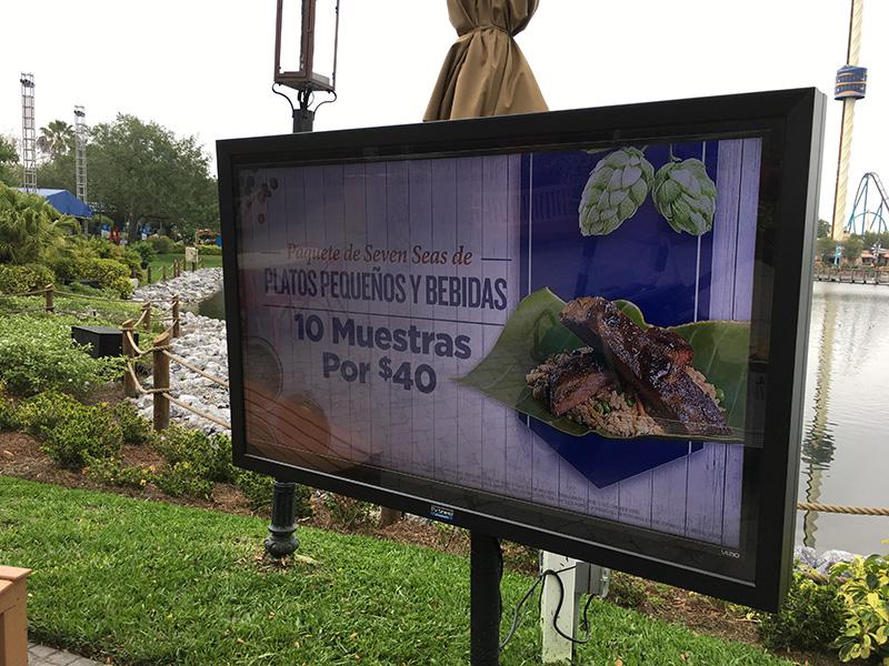 The TV Shield PRO Outdoor Menu Display Mounted on a Stand at a Theme Park